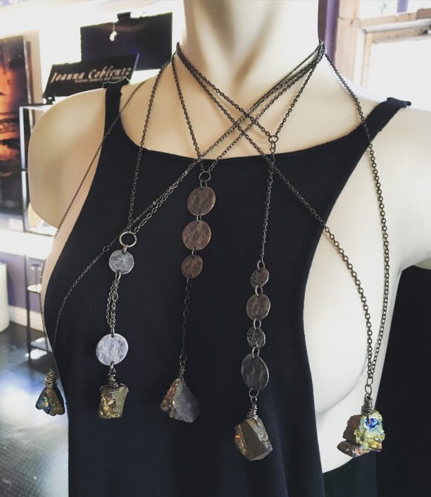 Black Tank Top with Multiple Hanging Necklaces for Display by Joanna Coblentz