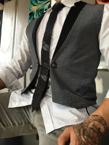 Grey Vest with Chain Button and Black Multimedia Tie by Joanna Coblentz