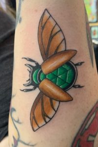 Flying beetle Tattoo by Shannon Haines